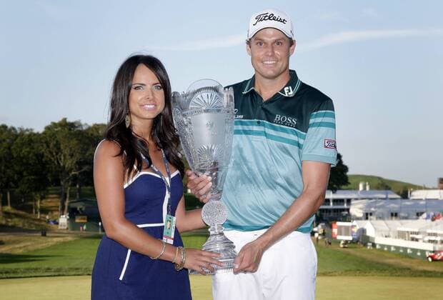 Nick Watney and wife Amber hold up the Championship Trophy after the final round of The Barclays 2012 FedExCup Playoffs at The Black Course at Bethpage State Park in Farmingdale, New York on August 26, 2012. Watney wins with a score of 10 under par.  NYP20120826132