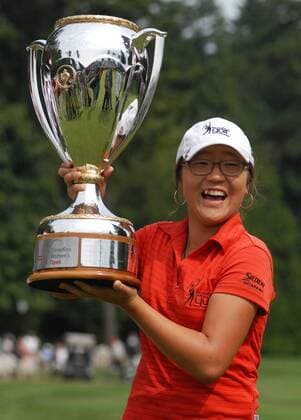 Fifteen-year-old Lydia Ko of New Zealand holds up the trophy during the LPGA Golf Damen Canadian Women s Open golf tournament at the Vancouver Golf Club in Coquitlam, B.C., on Aug. 26, 2012. Lydia Ko became the youngest player to win a LPGA Golf Damen Tour event. (Xinhua Sergei Bachlakov) CANADA-COQUITLAM-GOLF 