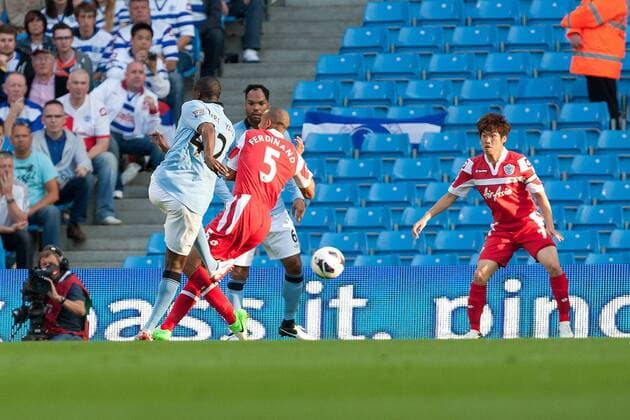 Football - Premier League - Manchester City vs. Queens Park Rangers QPR Yaya Toure of Manchester City strikes to open the scoring with a goal at the Etihad Stadium 