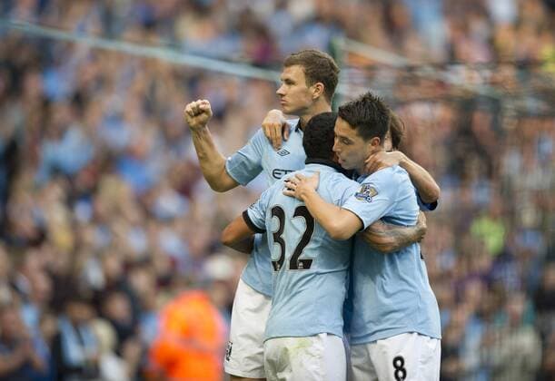 Football - Manchester City v Queens Park Rangers QPR - Barclays Premier League - The Etihad Stadium - Season 12 13 - 1 9 12 .Edin Dzeko of Manchester City celebrates scoring the second goal. EDITORIAL USE ONLY. No use with unauthorised audio, video, data, fixture lists, club league logos or live services. Online in-match use limited to 120 images, no video emulation. No use in betting, games or single club league player publications.