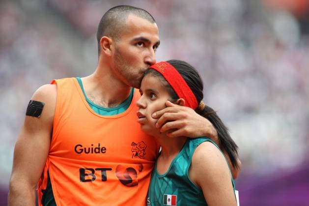 2.09.2012 London, England. Daniela Eugenia Velasco Maldonado (MEX) is kissed on the forehead by her guide Jose Guadalupe Fuentes Ortizion after the Women s 400m - T12 during Day 3 of the London Paralympics from the Olympic Stadium xJordanxMansfieldx  ActionPlus