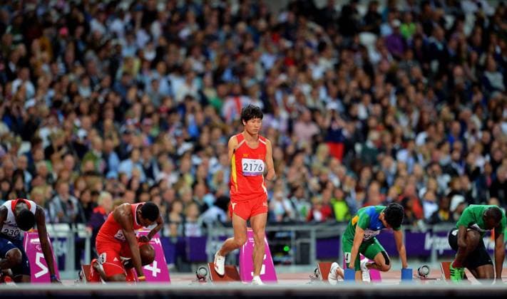 Gold medalist Zhao Xu (C) of China gets ready to start before the men s 100 T46 final at the London 2012 Paralympic Games in London, Britain, on Sept. 6, 2012. (Xinhua Lin Yiguang) BRITAIN-LONDON-PARALYMPIC GAMES-ATHLETCIS 
