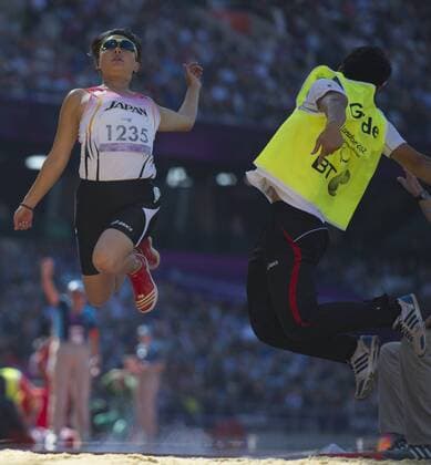 (120907) -- LONDON, Sept. 7, 2012 (Xinhua) -- Watamabe Shiho (L) of Japan competes during the women s long jump F11 12 final of the athletics event at the London 2012 Paralympic Games in London, Britain, on Sept. 7, 2012. (Xinhua Yang Lei) (zc) BRITAIN-LONDON-PARALYMPIC GAMES-ATHLETICS-WOMEN S LONG JUMP-F11 12 