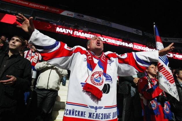 A fan reacts during a Russia memorial hockey match in Yaroslavl. The game commemorates an anniversary of the September 2011 plane crash in which 38 members of the HC Lokomotiv Yaroslavl hockey team and coaching staff died.  RE107BDD