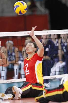 07.09.2012 London 2012 Sitting Volleyball Final Paralympic Games, from the ExCel Arena. Picture shows action from the gold medal contest U.S.A V. China. No.2 Hong Qin Lu (CHN)lobs to score a pint xMikexVareyx  ActionPlus11327943