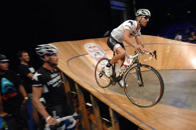 (120909) -- VANCOUVER, Sept. 9, 2012 (Xinhua) -- Chris Worsfold competes at the Canadian edition of Red Bull Mini Drome on Sept. 8, 2012 in Vancouver, Canada. Red Bull Mini Drome is unique Fixed Gear Event, where cyclists take their street skills to the track in a test of mental stamina, technical precision and raw strength. Red Bull Mini Drome brings skill, speed, balance, and bravado together on a steep and shrunken version, far from the traditional velodrome, to give competitors the most challenging and treacherous ride of their lives. (Xinhua Sergei Bachlakov) CANADA-VANCOUVER-CYCLING 