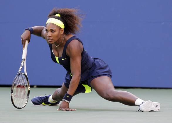 Serena Williams does a split after returning the ball in the second set of her 3 set victory in the Woman s Finals in Arthur Ashe Stadium at the Billie Jean King National Tennis Center in New York City on September 9, 2012.  NYP20120909168