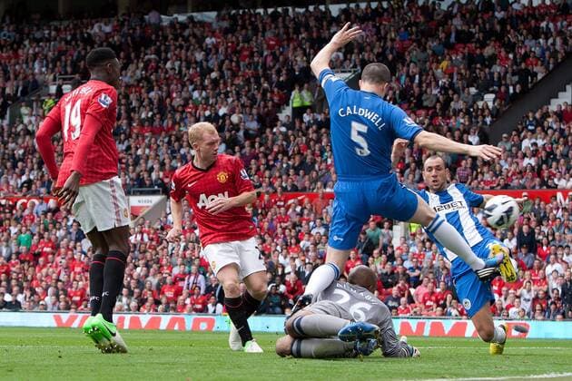 Football - Premier League - Manchester United vs. Wigan Athletic Paul Scholes of Manchester United scores the opening goal at Old Trafford 