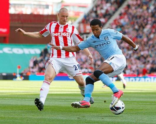 Manchester City s Scott Sinclair holds off Stoke City s Andy Wilkinson.Football - Stoke City v Manchester City - Barclays Premier League - Britannia Stadium - Season 12 13 - 15 9 12. EDITORIAL USE ONLY. No use with unauthorised audio, video, data, fixture lists, club league logos or live services. Online in-match use limited to 120 images, no video emulation. No use in betting, games or single club league player publications.