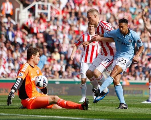 Stoke City s asmir Begovic saves from Manchester City s Gael Clichy.Football - Stoke City v Manchester City - Barclays Premier League - Britannia Stadium - Season 12 13 - 15 9 12. EDITORIAL USE ONLY. No use with unauthorised audio, video, data, fixture lists, club league logos or live services. Online in-match use limited to 120 images, no video emulation. No use in betting, games or single club league player publications.