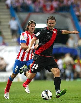 Atletico de Madrid s Filipe Luis Kasmirski and Rayo Vallecano s Andrija Delibasic during La Liga match. September 17,2012.  (1709201254)
