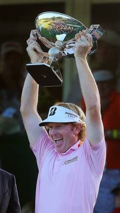 Sept. 23, 2012 - Atlanta, GA, USA - Brandt Snedeker hoists the FedExCup trophy after winning the Tour Championship and FedExCup finale at East Lake Golf Club at 10-under par in Atlanta, Georgia on Sunday, Sept. 23, 2012. Tour Championship - ZUMAm67
