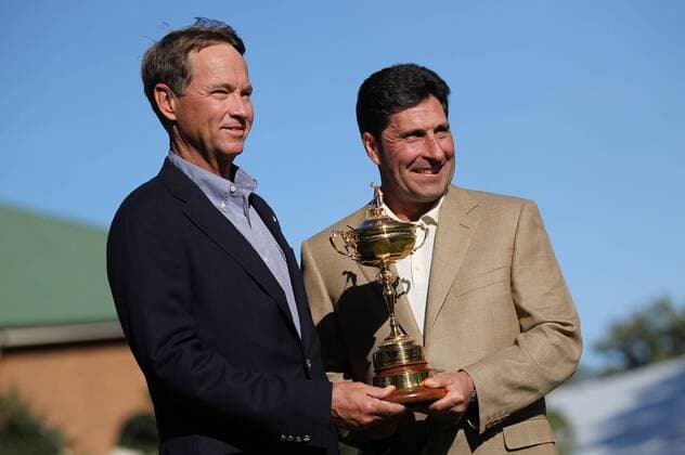 PGA-Ryder Cup 2012 Captains Davis Love III and Jose Maria Olazabal pose for pictures with the Ryder Cup in front of the Medinah clubhouse Monday afternoon. 