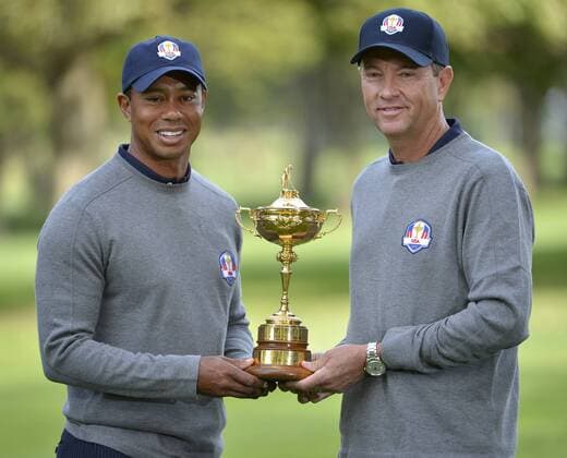 United States Ryder Cup team captain Davis Love III (R) and Tiger Woods pose for photos at the 39th Ryder Cup at Medinah Country Club on Tuesday, September 25, 2012 in Medinah, Illinois. Ryder Cup tournament play begins Friday.  BKX2012092547