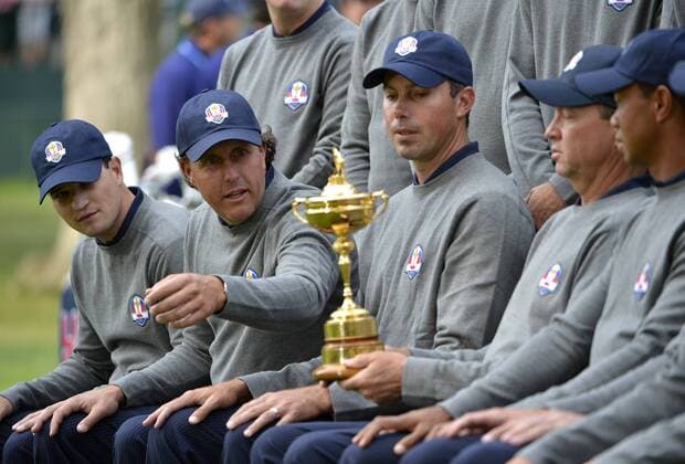 United States Ryder Cup teammates Zach Johnson (L-R), Matt Kuchar, team captain Davis Love III and Tiger Woods get ready for a team photo at the 39th Ryder Cup at Medinah Country Club on Tuesday, September 25, 2012 in Medinah, Illinois. Ryder Cup tournament play begins Friday.  BKX2012092536