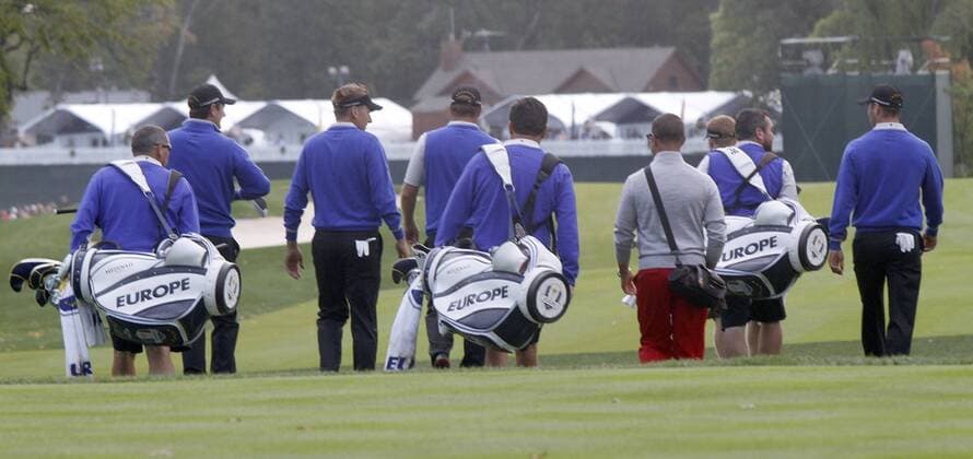 European teammates Justin Rose, Ian Poulter, Peter Hanson and Martin Kaymer walk down the first fairway with their caddies during the second day of practice rounds at Medinah Country Club, site of the 39th Ryder Cup matches September 26, 2012 in Medinah, Illinois.  MED2012092653