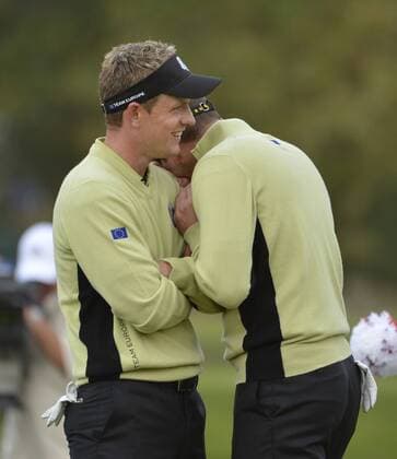 Team Europe s Sergio Garcia of Spain (R) jokes with teammate Luke Donald of England after Donald missed a birdie putt on the seventh hole at the 39th Ryder Cup at Medinah Country Club on September 28, 2012 in Medinah, Illinois.  BKX2012092823