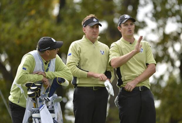 Team Europe s Ian Poulter of England (C) and teammate Justin Rose of England (R) discuss the tee shot on the 17th hole at the 39th Ryder Cup at Medinah Country Club on September 28, 2012 in Medinah, Illinois.  BKX2012092856