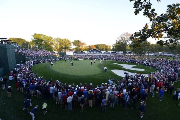 Team USA s Tiger Woods and teammate Steve Striker finish their match against Team Europe s Nicolas Colsaerts of Belgium and Lee Westwood of England on the 18th hole at the 39th Ryder Cup at Medinah Country Club on September 28, 2012 in Medinah, Illinois. After the first day of play the United States leads Europe 5-3.  BKX2012092887