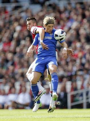 Arsenal s Carl Jenkinson tussles with Chelsea s Fernando Torres..Football - Barclays Premier League - Arsenal v Chelsea - Emirates Stadium - 29 9 12 ..Mandatory Credit: David Klein Sportimage..EDITORIAL USE ONLY. No use with unauthorized audio, video, data, fixture lists, club league logos or ?live? services. Online in-match use limited to 45 images, no video emulation. No use in betting, games or single club league player publications. Please contact your account representative for further details.... EDITORIAL USE ONLY. No use with unauthorised audio, video, data, fixture lists, club league logos or live services. Online in-match use limited to 120 images, no video emulation. No use in betting, games or single club league player publications.