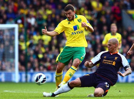 Football - Premier League - Norwich City vs. Liverpool FC - Norwich City s Robert Snodgrass is tackled by Liverpool s Martin Skrtel at Carrow Road, Norwich  4318-4318