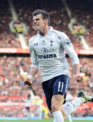 Gareth Bale of Tottenham celebrates scoring the second goal -Barclays Premier League - Manchester United (ManU) vs Tottenham Hotspur - Old Trafford Stadium - Manchester - 29 09 12 - EDITORIAL USE ONLY. No use with unauthorised audio, video, data, fixture lists, club league logos or live services. Online in-match use limited to 120 images, no video emulation. No use in betting, games or single club league player publications.