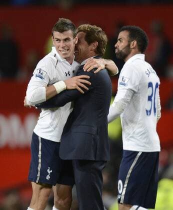 Gareth Bale of Tottenham and Andre Villas Boas manager of Tottenham celebrate the win - Barclays Premier League - Manchester United (ManU) vs Tottenham Hotspur - Old Trafford Stadium - Manchester - 29 09 12 - EDITORIAL USE ONLY. No use with unauthorised audio, video, data, fixture lists, club league logos or live services. Online in-match use limited to 120 images, no video emulation. No use in betting, games or single club league player publications.