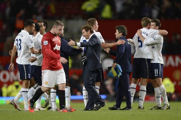 Tottenham celebrate as Wayne Rooney walks past dejected -Barclays Premier League - Manchester United (ManU) vs Tottenham Hotspur - Old Trafford Stadium - Manchester - 29 09 12 - EDITORIAL USE ONLY. No use with unauthorised audio, video, data, fixture lists, club league logos or live services. Online in-match use limited to 120 images, no video emulation. No use in betting, games or single club league player publications.