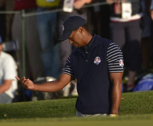 Team USA s Tiger Woods expresses his displeasure at his bunker shot on the 15th green at the 39th Ryder Cup at Medinah Country Club on September 29, 2012 in Medinah, Illinois. After the second day of play the United States leads Europe 10-6 and needs 4 1 2 points in the final round to win the Ryder Cup.  BKX2012092958