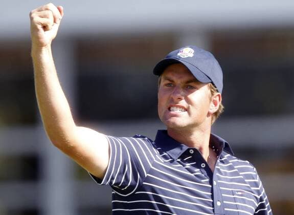 Team USA s Webb Simpson celebrates his birdie putt on the 5th green at the 39th Ryder Cup at Medinah Country Club on September 29, 2012 in Medinah, Illinois. After two days the United States leads team Europe 10-6.  MED2012092924