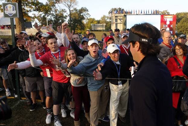Sept. 29, 2012 - Medinah, IL, USA - Team USA s Bubba Watson high-fives fans on the 1st hole during the Ryder Cup golf tournament at Medinah Country Club in Medinah, Illinois, on Saturday, September 29, 2012. Ryder Cup golf tournament - ZUMAm67