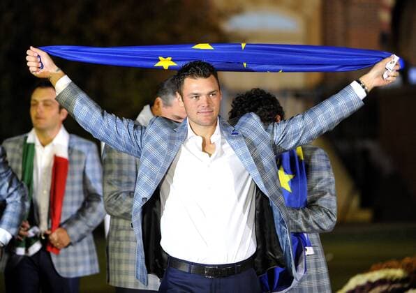 Team Europe s Martin Kaymer of Germany holds the European Union flag after the closing ceremony at the 39th Ryder Cup at Medinah Country Club on September 30, 2012 in Medinah, Illinois. Team Europe defeated Team USA 14 1 2 to 13 1 3 points.  CHI2012093024
