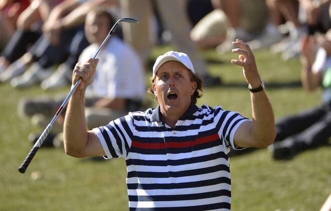 Team USA s Phil Mickelson reacts after nearly chipping in for birdie on the 17th hole at the 39th Ryder Cup at Medinah Country Club on September 30, 2012 in Medinah, Illinois. Team Europe defeated Team USA 14 1 2 to 13 1 3 points.  CHI2012093045