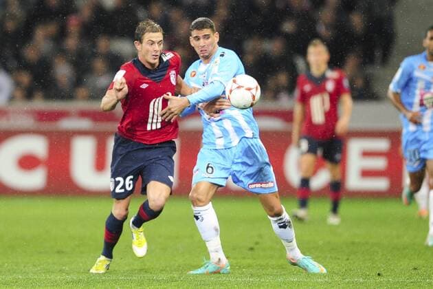 Nolan Roux (Lille) vs Carl Medjani (ajaccio) FOOTBALL : Lille Losc vs Ajaccio - L1 - 06 10 2012 JBAutissier Panoramic 
