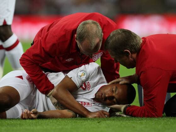 England v San Marino - World Cup Qualifier . . 12.10.12 Theo Walcott (E) is winded, and helped by the physios. 