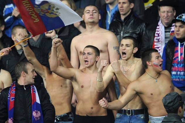 Russia s fans root for their team in a 2014 FIFA World Cup Group F qualifying football match against Portugal at Luzhniki Stadium.  RE10AAF7