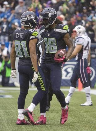 Seattle Seahawks wide receivers Golden Tate (81) and Sidney Rice celebrates Rices 46-yard touchdown pass from Russell Wilson against the New England Patriots at CenturyLink Field in Seattle, Washington on October 14, 2012. With 1:18 remaining the Seahawks rallied for 14 points to stun the New England Patriots 24-23.  SEA2012101403