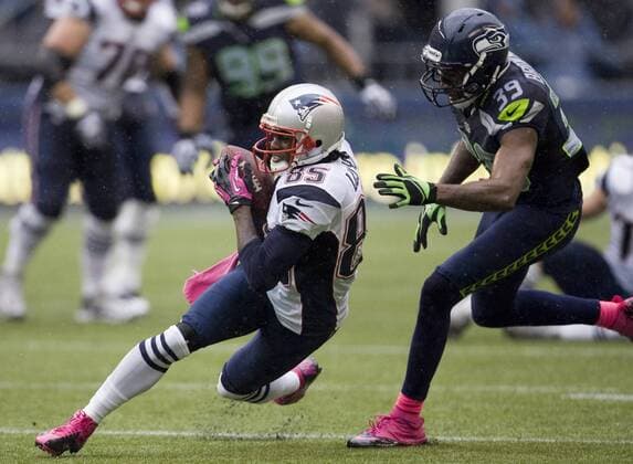 New England Patriots wide receiverBrandon Lloyd (85) is chased by Seattle Seahawks cornerback Brandon Browner at CenturyLink Field in Seattle, Washington on October 14, 2012. With 1:18 remaining the Seahawks rallied for 14 points to stun the New England Patriots 24-23. Lloyd caught six passes for 80 yards in the Patriots loss.  SEA2012101415