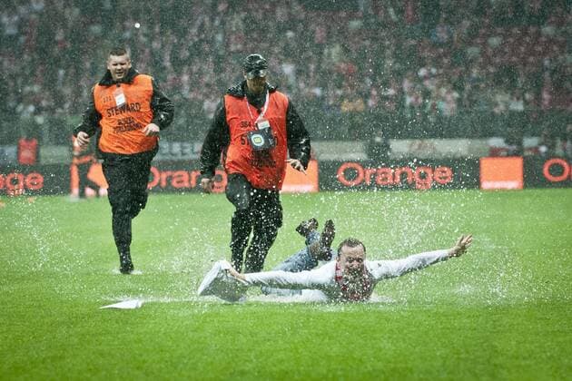 World Cup qualification match Poland vs. England on October 16, 2012 at the National Arena in Warsaw, Poland. Polish fans trespassing the pitch The match has been postponed due to a heavy rain in Warsaw  EN_01055867_0011