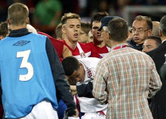16.10.2012 Krusevac(Serbia) Serbia-England UEFA Under 21 Euro qualify play off men s football After match England football player Thomas Ince (central in white dress) gets hits from crowd beside Milan Rodic(central left behind),Djordje Despotovic(central right behind) and Milan Kosanovic(r) Serbia and Martin Thomas(2nd from right) England goalkeeper coach 