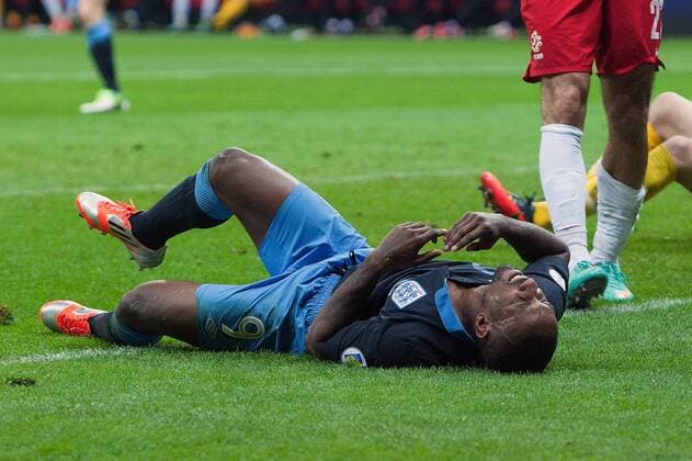 World Cup Qualifier -- Poland vs. England -- Jermaine Defoe of England lies in pain following a collision at the National Stadium, Warsaw 