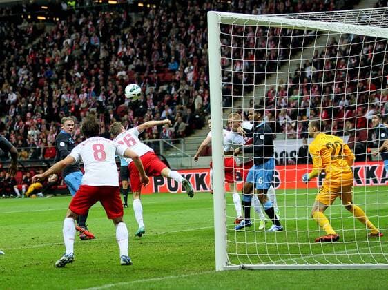 England s Wayne Rooney scoring his sides opening goal..Poland v England - FIFA World Cup Qualifier - National Stadium, Warsaw Stadium- 17 10 12 - Picture David Klein Sportimage EDITORIAL USE ONLY. No use with unauthorised audio, video, data, fixture lists, club league logos or live services. Online in-match use limited to 120 images, no video emulation. No use in betting, games or single club league player publications.