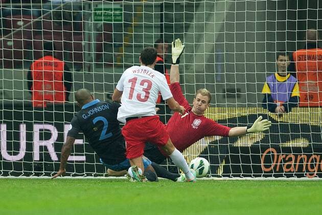 World Cup Qualifier -- Poland vs. England -- Glen Johnson and Joe Hart of England go all out to stop Pawel Wszolek of Poland scoring at the National Stadium, Warsaw 