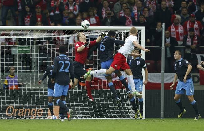 Poland s Kamil Glik scoring his sides opening goal..Poland v England - FIFA World Cup Qualifier - National Stadium, Warsaw Stadium- 17 10 12 - Picture David Klein Sportimage EDITORIAL USE ONLY. No use with unauthorised audio, video, data, fixture lists, club league logos or live services. Online in-match use limited to 120 images, no video emulation. No use in betting, games or single club league player publications.