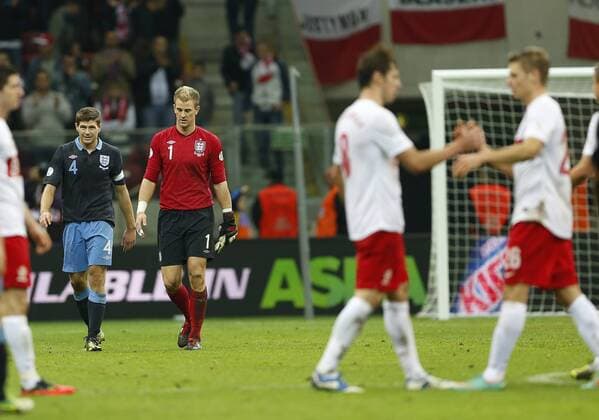 England s Steven Gerrard and Joe Hart look on dejected at the final whistle..Poland v England - FIFA World Cup Qualifier - National Stadium, Warsaw Stadium- 17 10 12 - Picture David Klein Sportimage EDITORIAL USE ONLY. No use with unauthorised audio, video, data, fixture lists, club league logos or live services. Online in-match use limited to 120 images, no video emulation. No use in betting, games or single club league player publications.