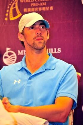 US Olympic swimming champion Michael Phelps attends a press conference for the 2012 Mission Hills World Celebrity Pro-Am golf tournament in Haikou city, south Chinas Hainan province, 18 October 2012. Ronaldo, Michael Phelps highlight press conference for World Celebrity Pro-Am golf tournament in Haikou  20121018_35515