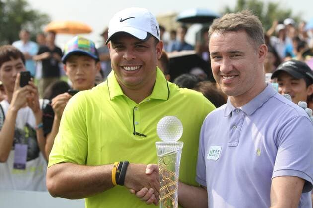 HAIKOU, CHINA - OCTOBER 19: (CHINA OUT) Ronaldo Nazario of Brazil shakes hands with Stephen Hendry of Scotland (R) during day one of the Mission Hills Star Trophy at the Mission Hills Golf Club on October 19, 2012 in Haikou, Hainan Province of China.  CFP432801992 