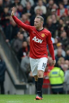 Wayne Rooney of Manchester United waves to his family after scoring his goal - Barclays Premier League - Manchester United (ManU) vs Stoke City - Old Trafford Stadium - Manchester - 20 10 12 - EDITORIAL USE ONLY. No use with unauthorised audio, video, data, fixture lists, club league logos or live services. Online in-match use limited to 120 images, no video emulation. No use in betting, games or single club league player publications.