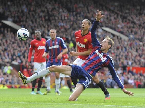 Peter Crouch of Stoke City stretches to try and connect withe ball - Barclays Premier League - Manchester United (ManU) vs Stoke City - Old Trafford Stadium - Manchester - 20 10 12 - EDITORIAL USE ONLY. No use with unauthorised audio, video, data, fixture lists, club league logos or live services. Online in-match use limited to 120 images, no video emulation. No use in betting, games or single club league player publications.
