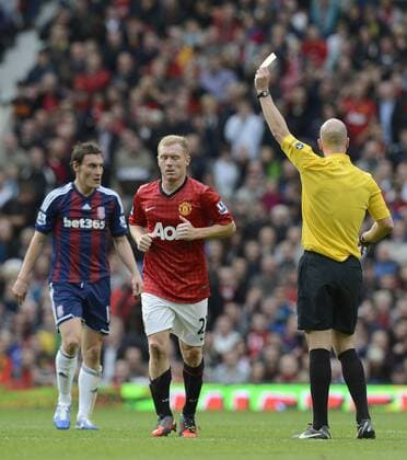 Paul Scholes of Manchester United receives a yellow card - Barclays Premier League - Manchester United (ManU) vs Stoke City - Old Trafford Stadium - Manchester - 20 10 12 - EDITORIAL USE ONLY. No use with unauthorised audio, video, data, fixture lists, club league logos or live services. Online in-match use limited to 120 images, no video emulation. No use in betting, games or single club league player publications.
